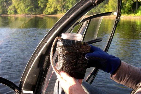 Bacteria sample in weighted throw/collection bottle.