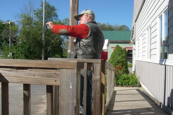 Back at the FOMB lab, sample bottles are drained to the 100 ml mark.